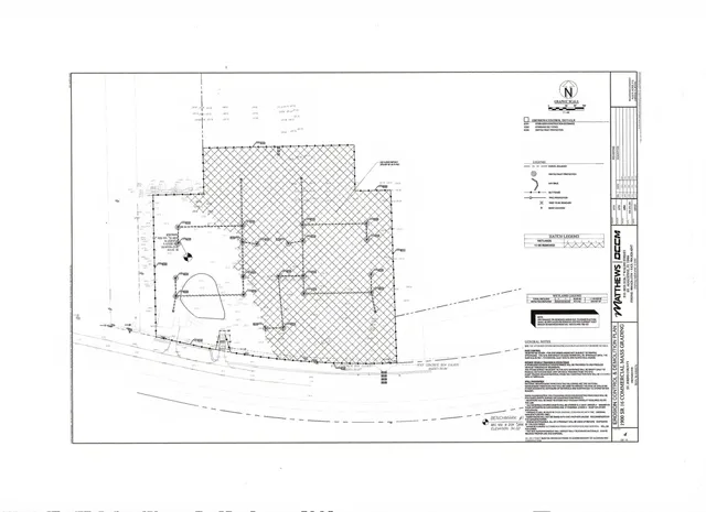 a view of swimming pool with lawn chairs and plants