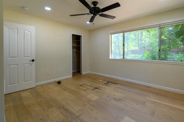 a bathroom with a granite countertop sink mirror and double