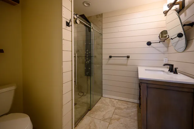 a view of a house with yard and sitting area