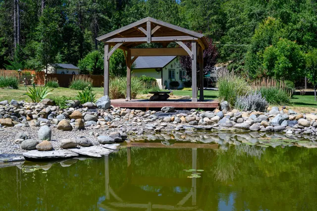 a bunch of flowers and covered with wooden fence