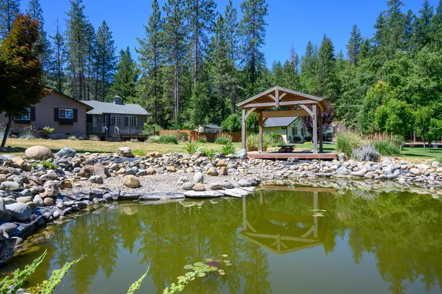 a view of a lake with sitting area