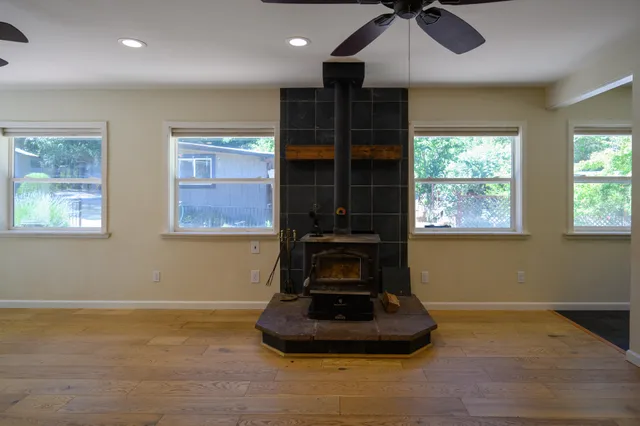 a view of kitchen with window and ceiling fan