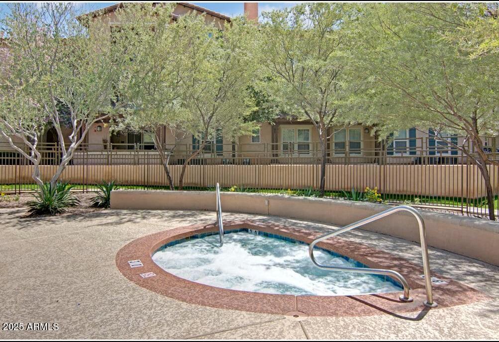 3825 West Anthem Way, Unit A1 Anthem, AZ 85086 - Photo 9 of 11 a backyard of a house with yard fire pit and outdoor seating