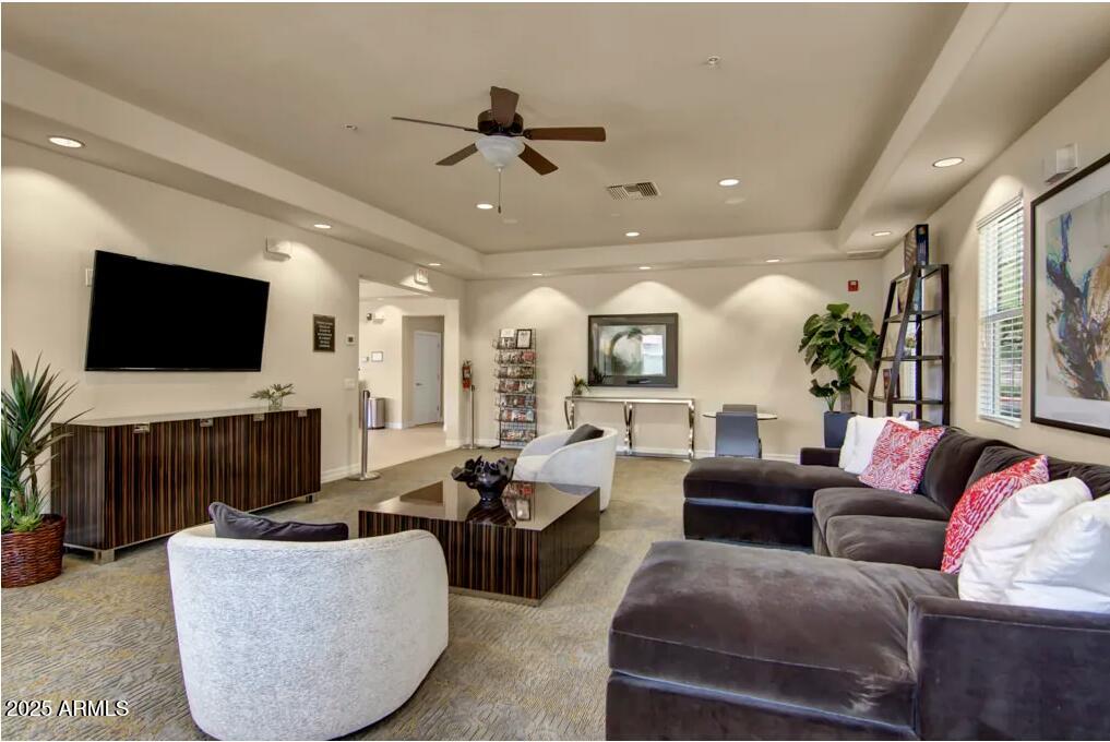 3825 West Anthem Way, Unit A1 Anthem, AZ 85086 - Photo 10 of 11 a living room with furniture and a flat screen tv