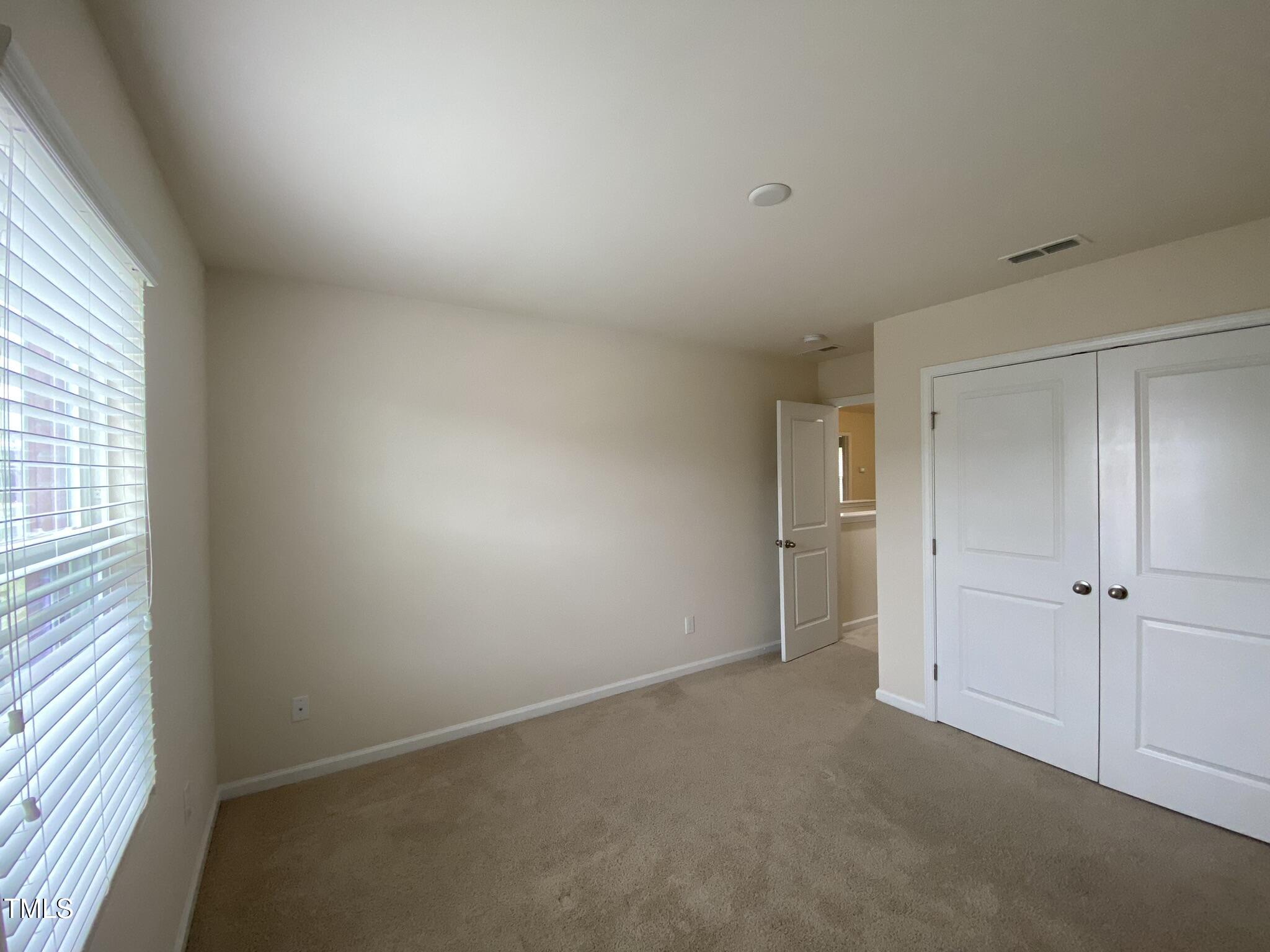3545 Massey Ridge Court Raleigh, NC 27616 - Photo 24 of 38 an empty room with windows