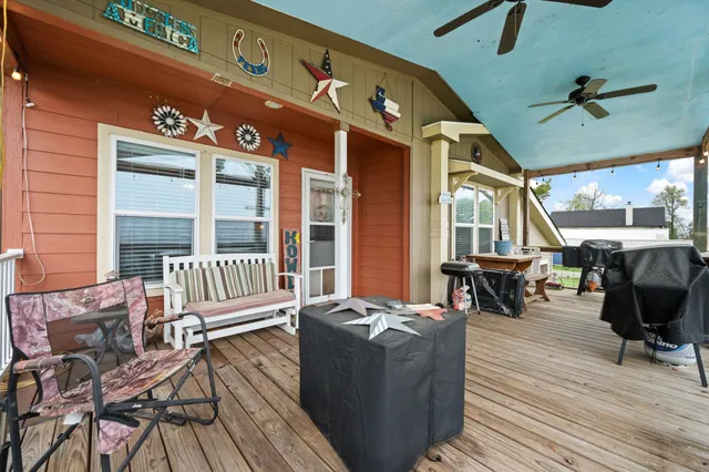 a balcony with furniture and wooden floor