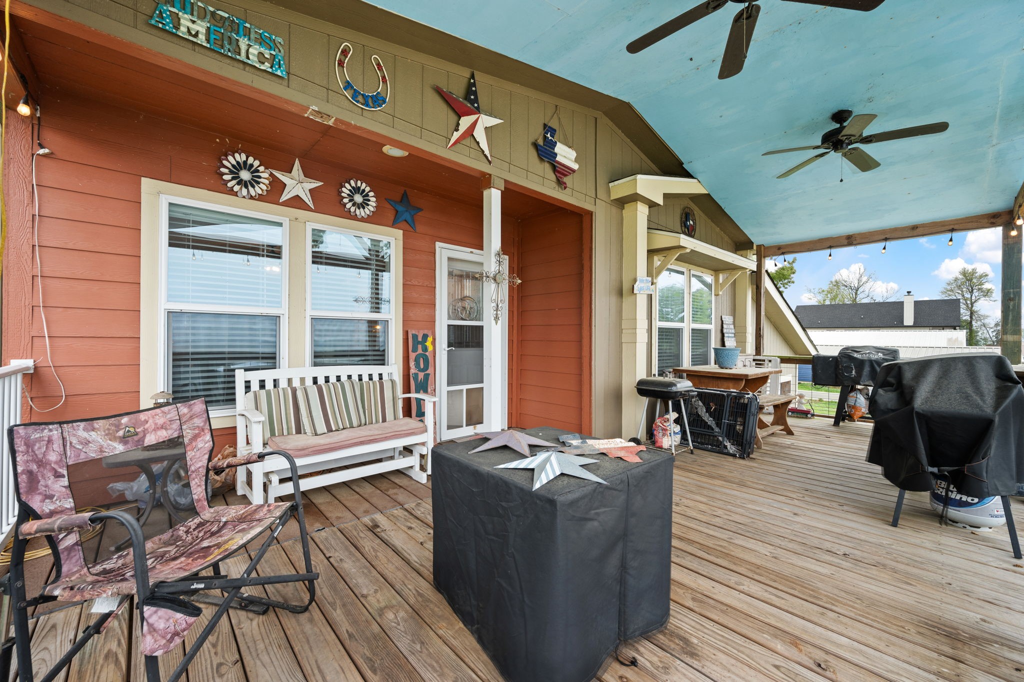 a balcony with furniture and wooden floor