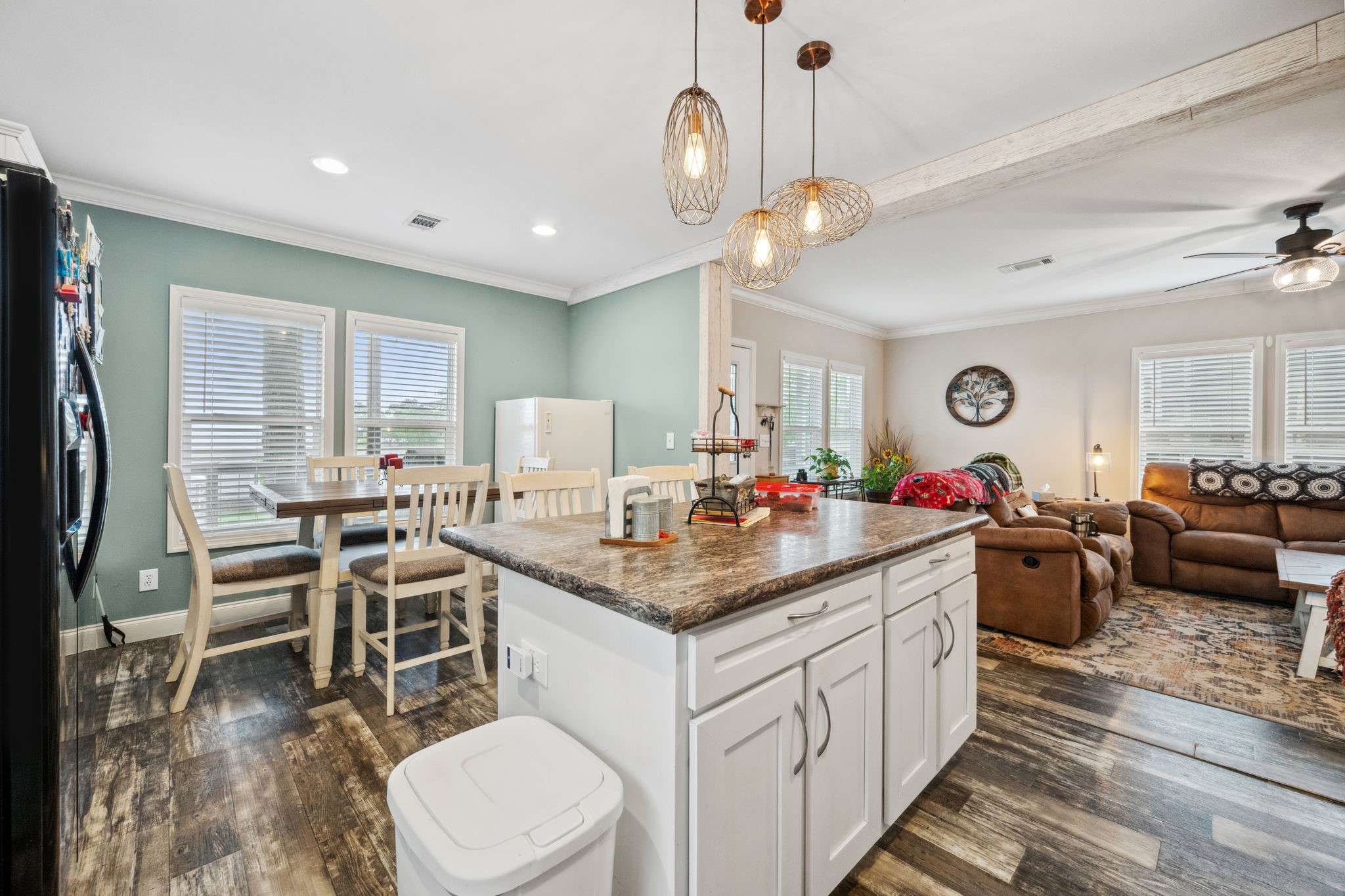 730 Coco Loop Point Blank, TX 77364 - Photo 13 of 42 a kitchen with a dining table chairs sink and cabinets