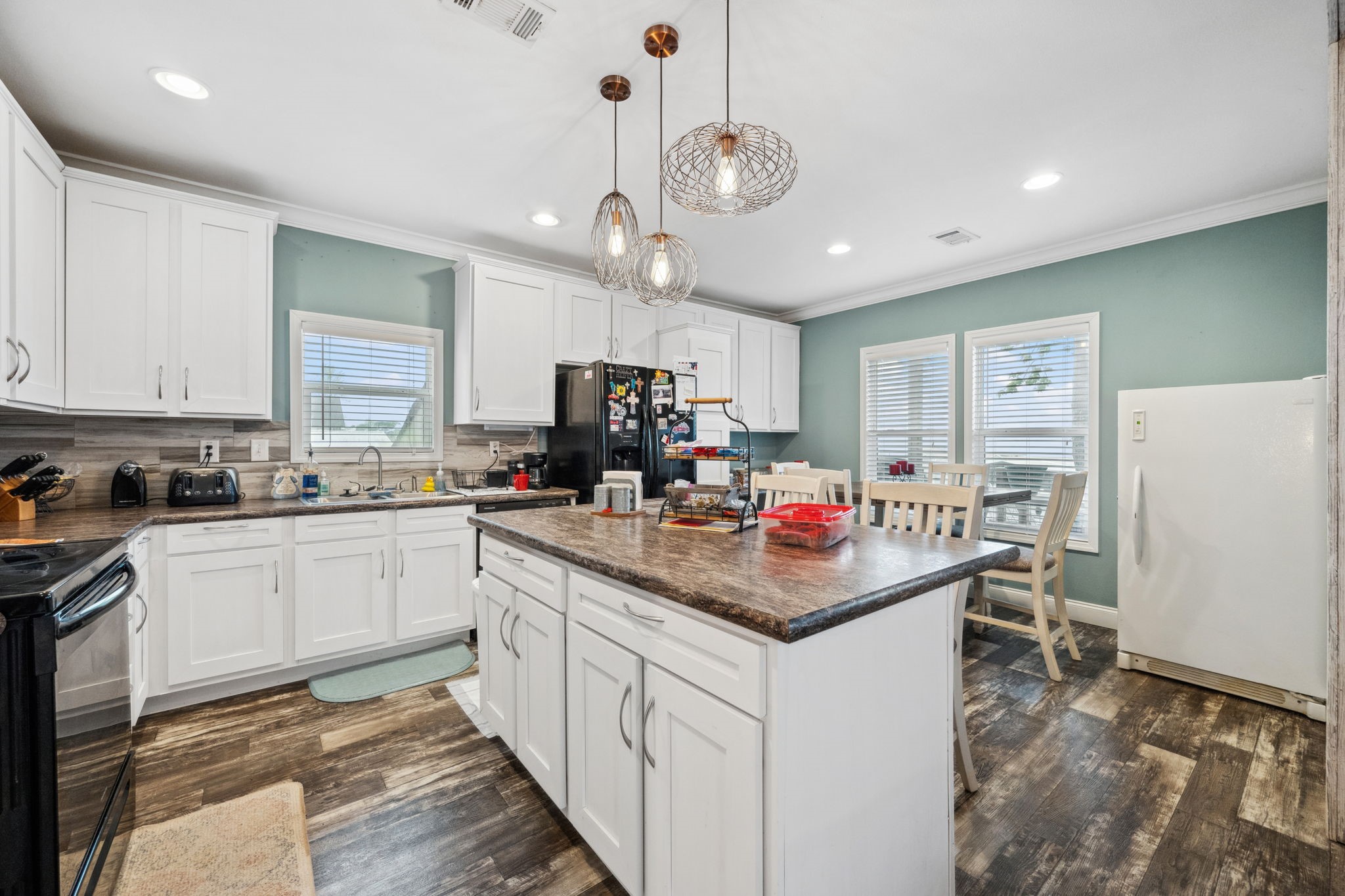 730 Coco Loop Point Blank, TX 77364 - Photo 14 of 42 a kitchen that has a lot of cabinets in it and appliances