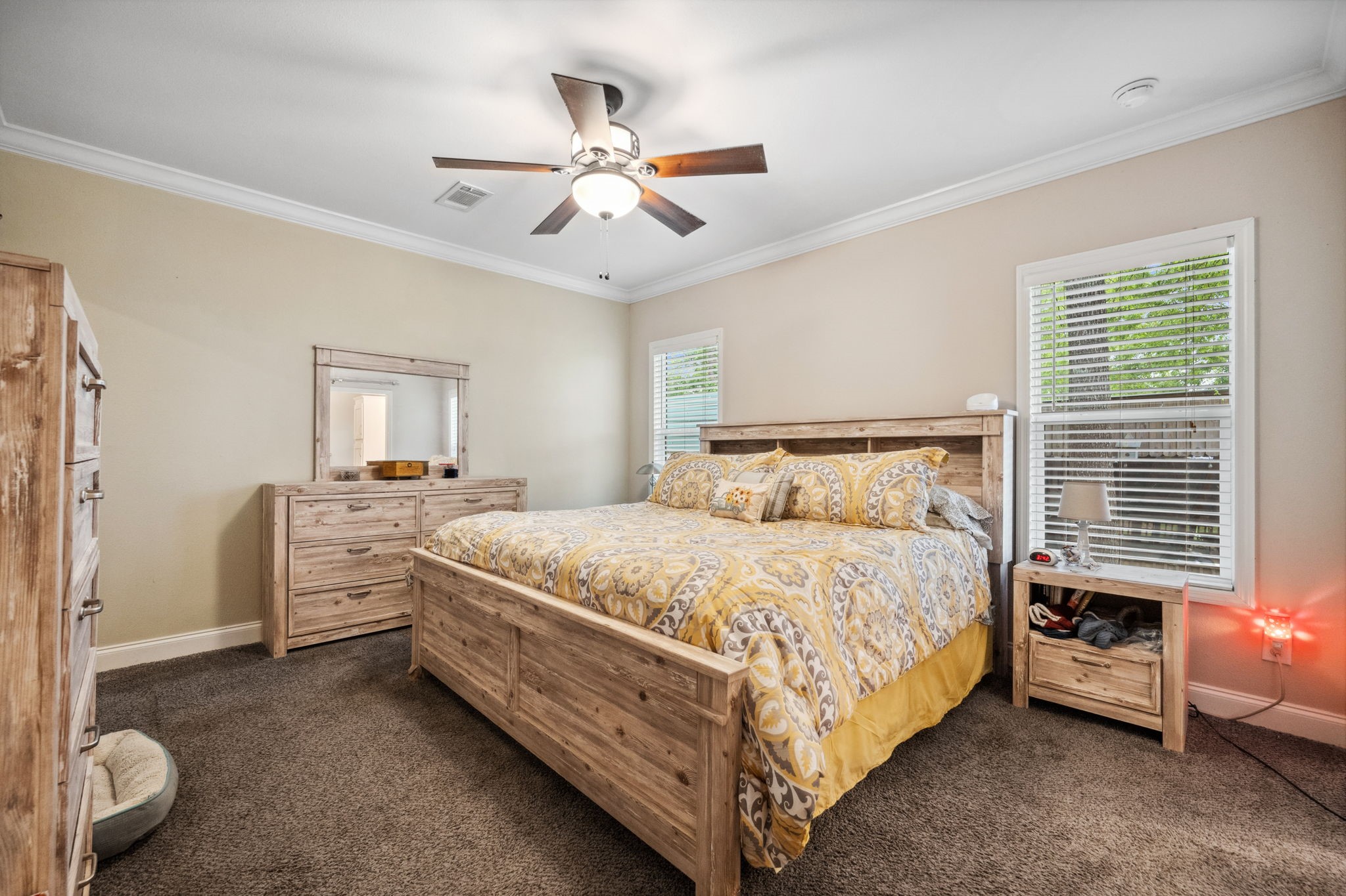 730 Coco Loop Point Blank, TX 77364 - Photo 19 of 42 a bed room with a bed and a chandelier