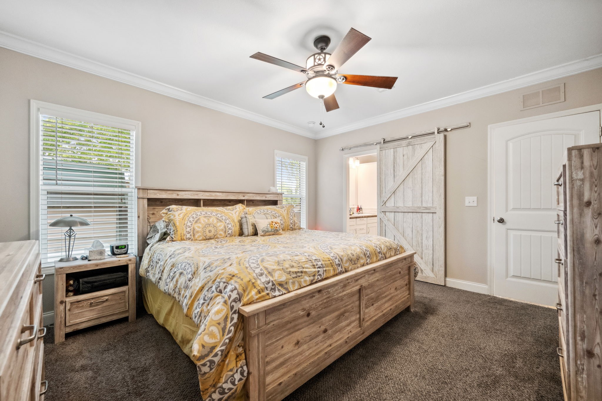 730 Coco Loop Point Blank, TX 77364 - Photo 20 of 42 a bed room with a bed and a ceiling fan