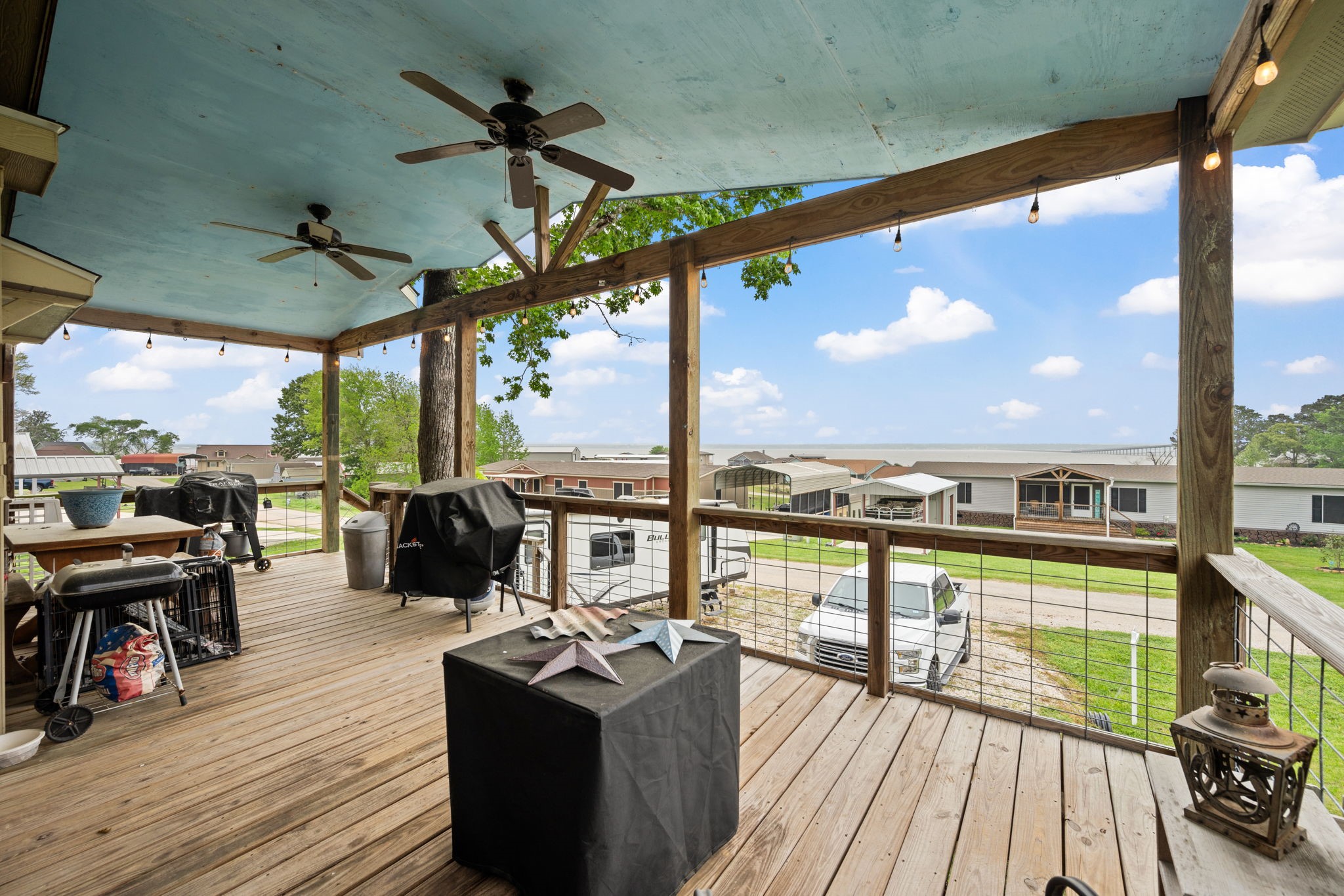 730 Coco Loop Point Blank, TX 77364 - Photo 2 of 42 a view of a balcony with chairs and wooden floor