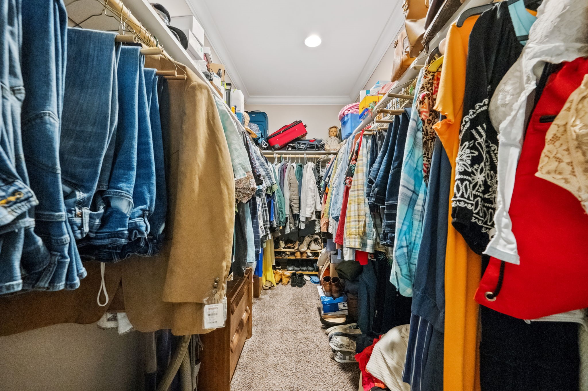 730 Coco Loop Point Blank, TX 77364 - Photo 23 of 42 a view of walk in closet with clothes