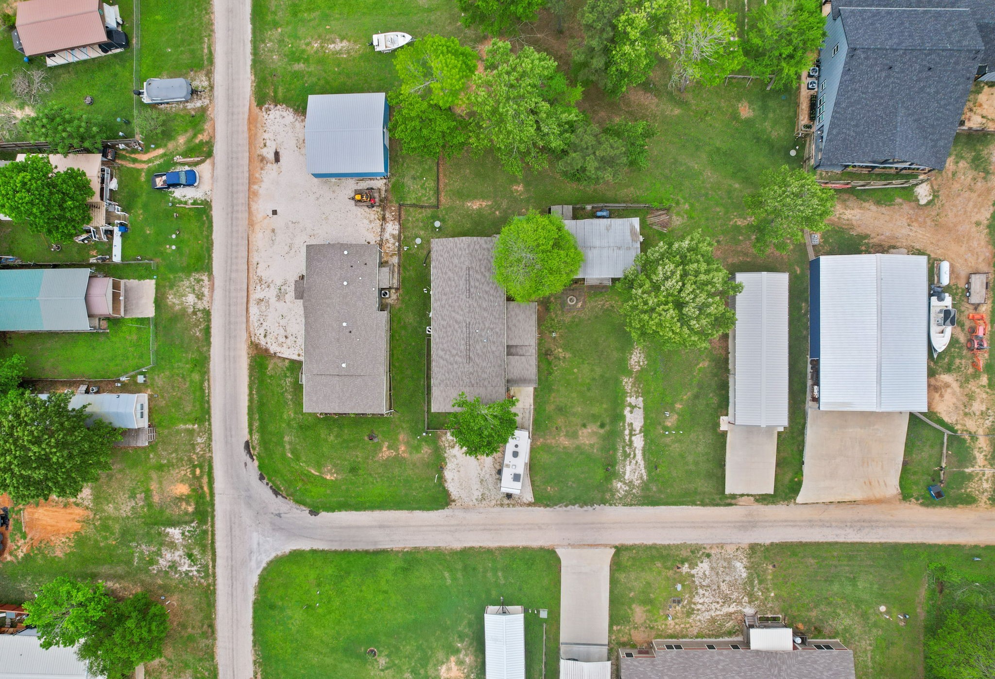 730 Coco Loop Point Blank, TX 77364 - Photo 26 of 42 aerial view of a house with a yard and potted plants