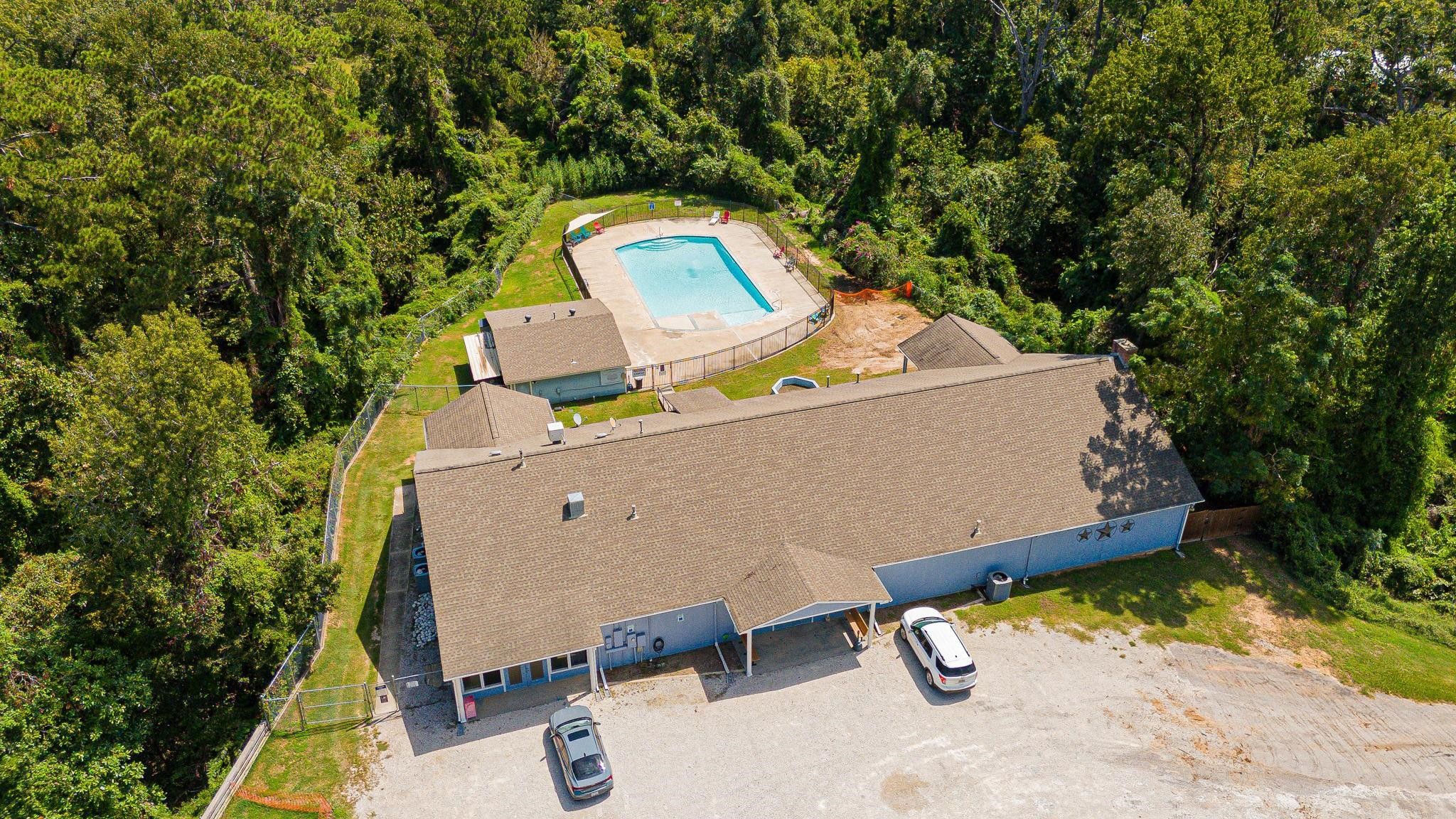 730 Coco Loop Point Blank, TX 77364 - Photo 27 of 42 an aerial view of a house with a swimming pool