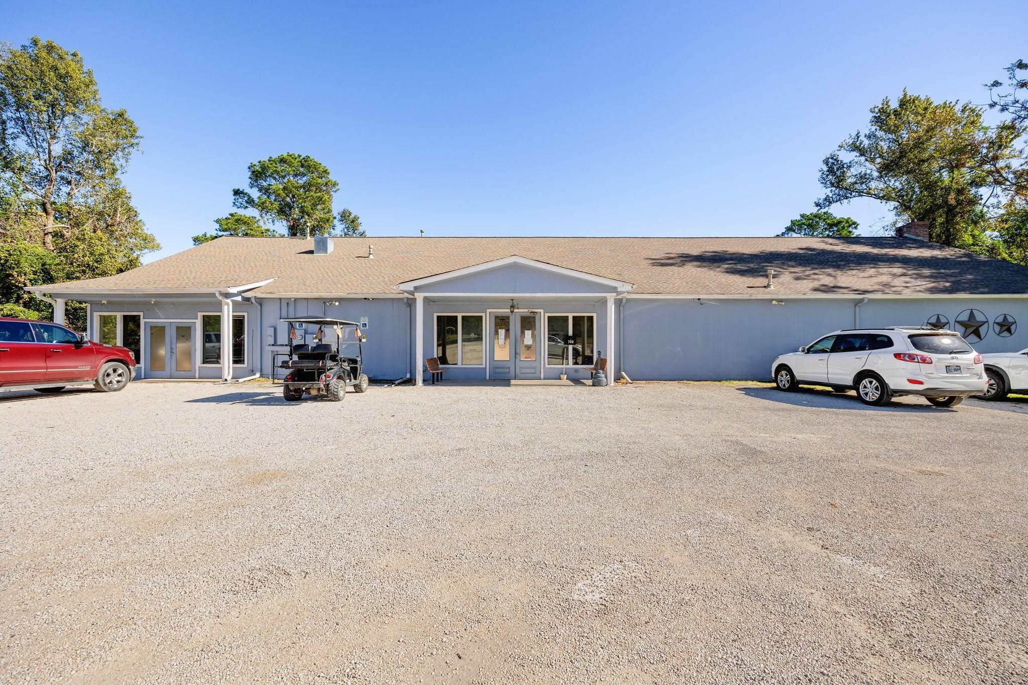 730 Coco Loop Point Blank, TX 77364 - Photo 28 of 42 a car parked in front of house with a yard