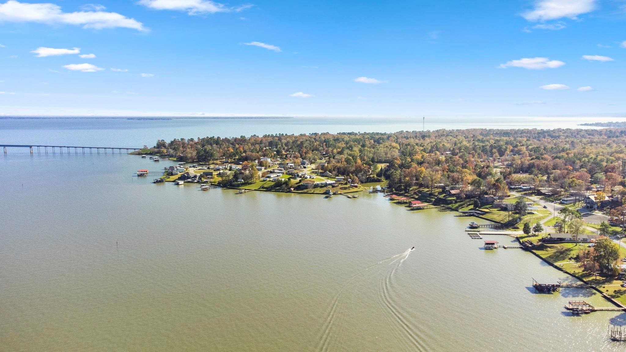 730 Coco Loop Point Blank, TX 77364 - Photo 33 of 42 an aerial view of ocean and residential houses with outdoor space