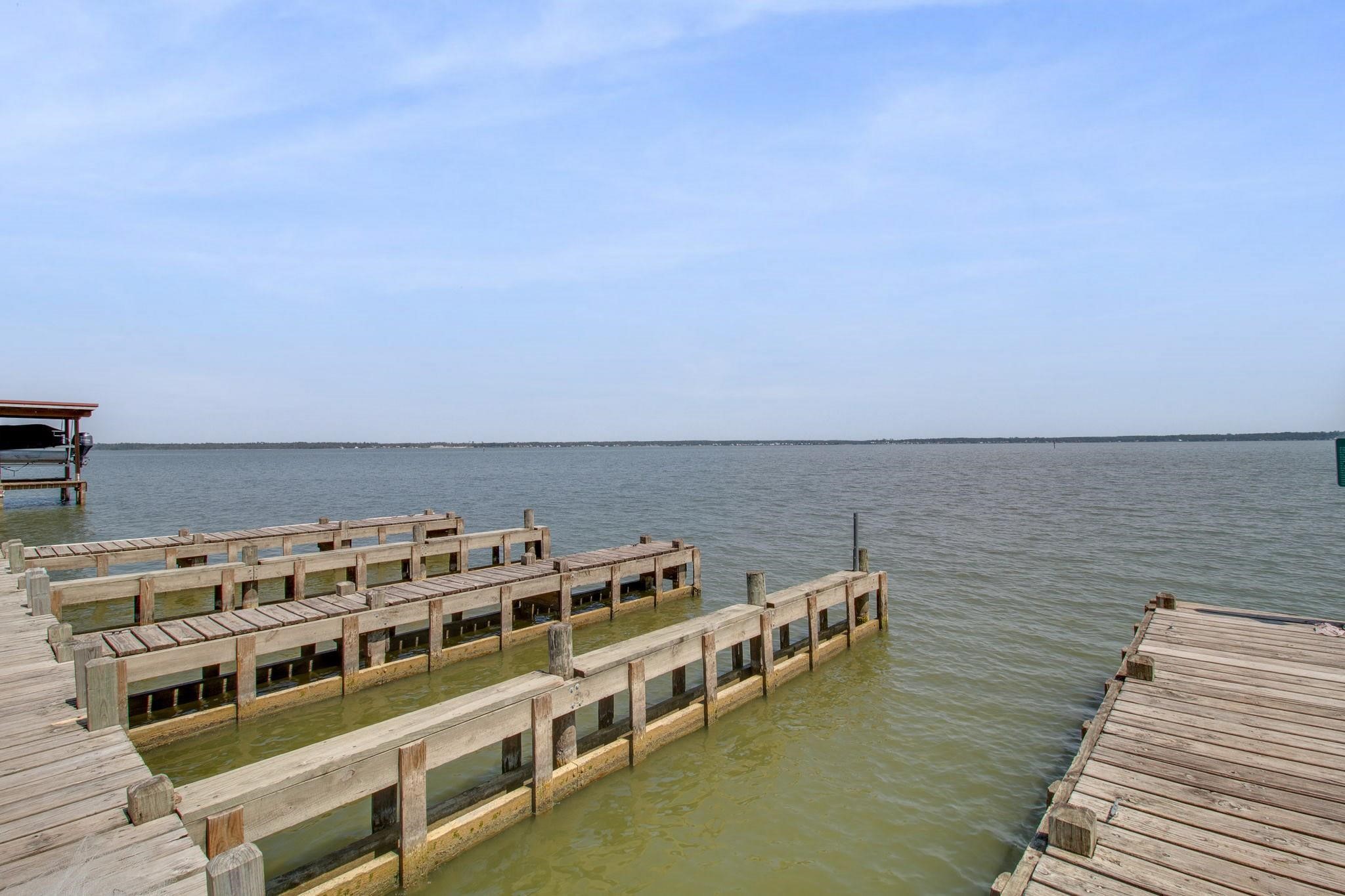730 Coco Loop Point Blank, TX 77364 - Photo 39 of 42 a view of a large building with a lake