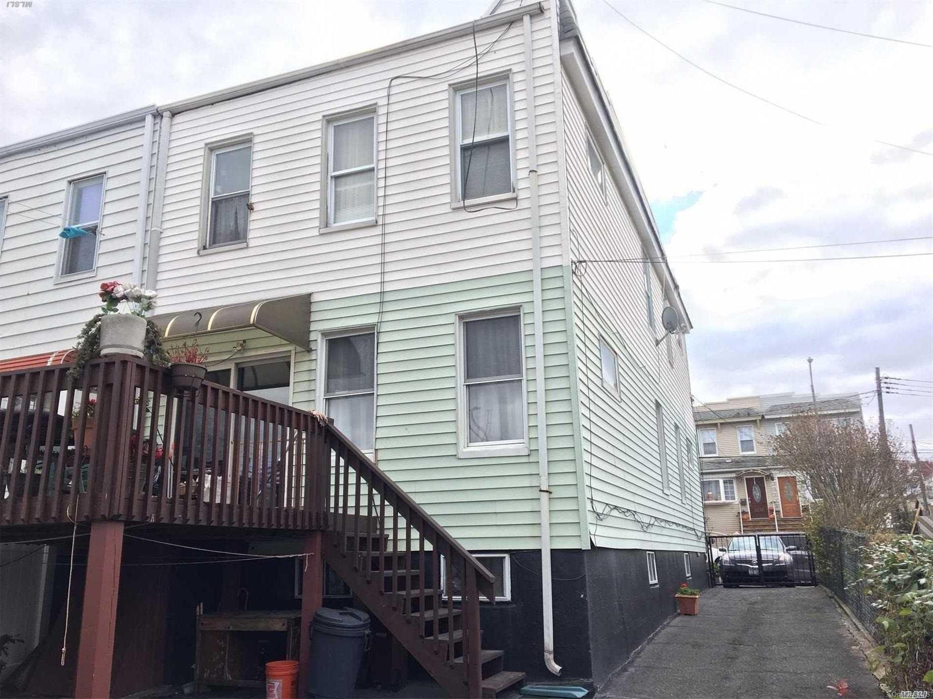 60-13 59th Road Queens, NY 11378 - Photo 4 of 20 a view of a house with a deck