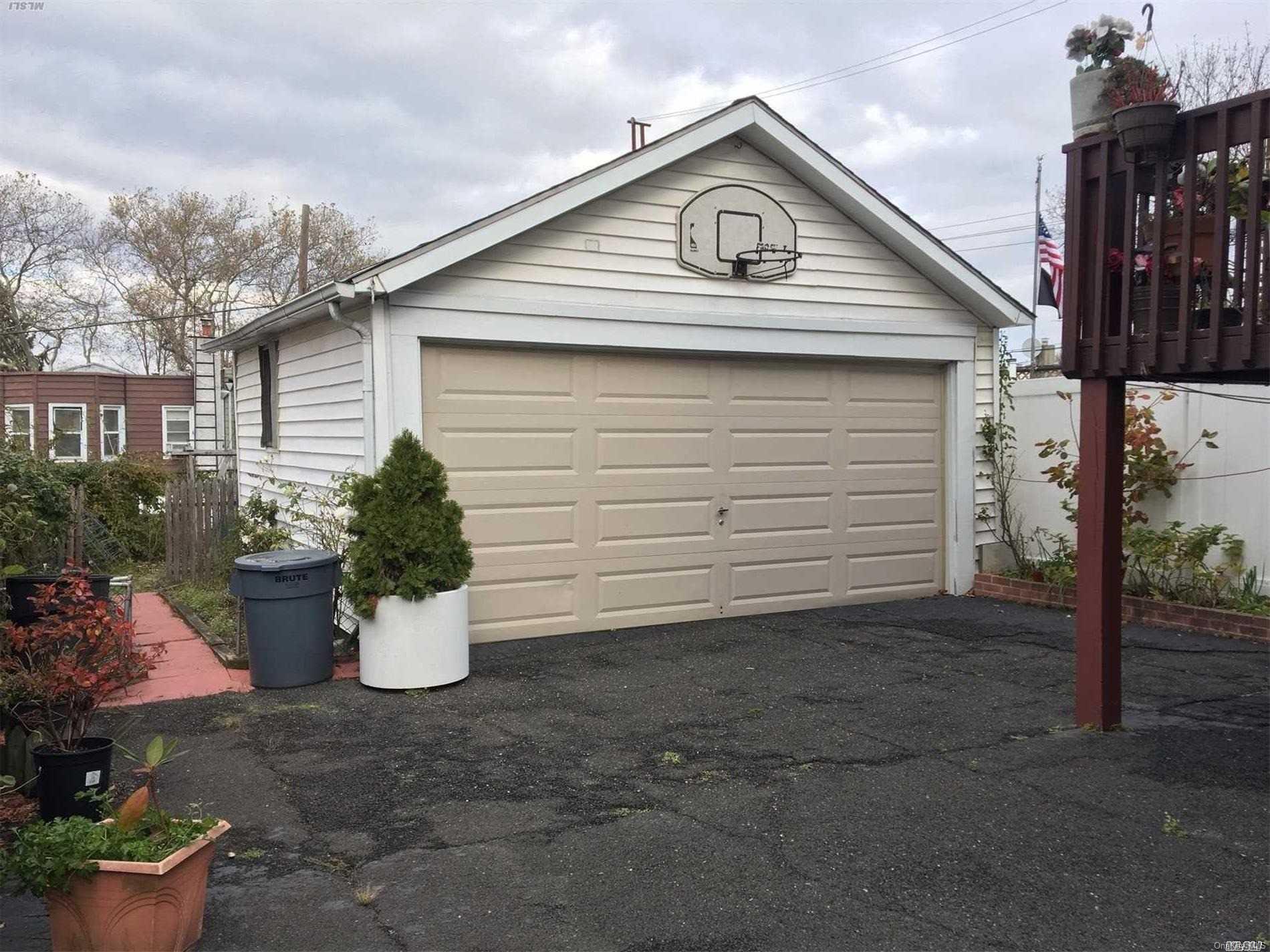60-13 59th Road Queens, NY 11378 - Photo 5 of 20 a view of a small white house