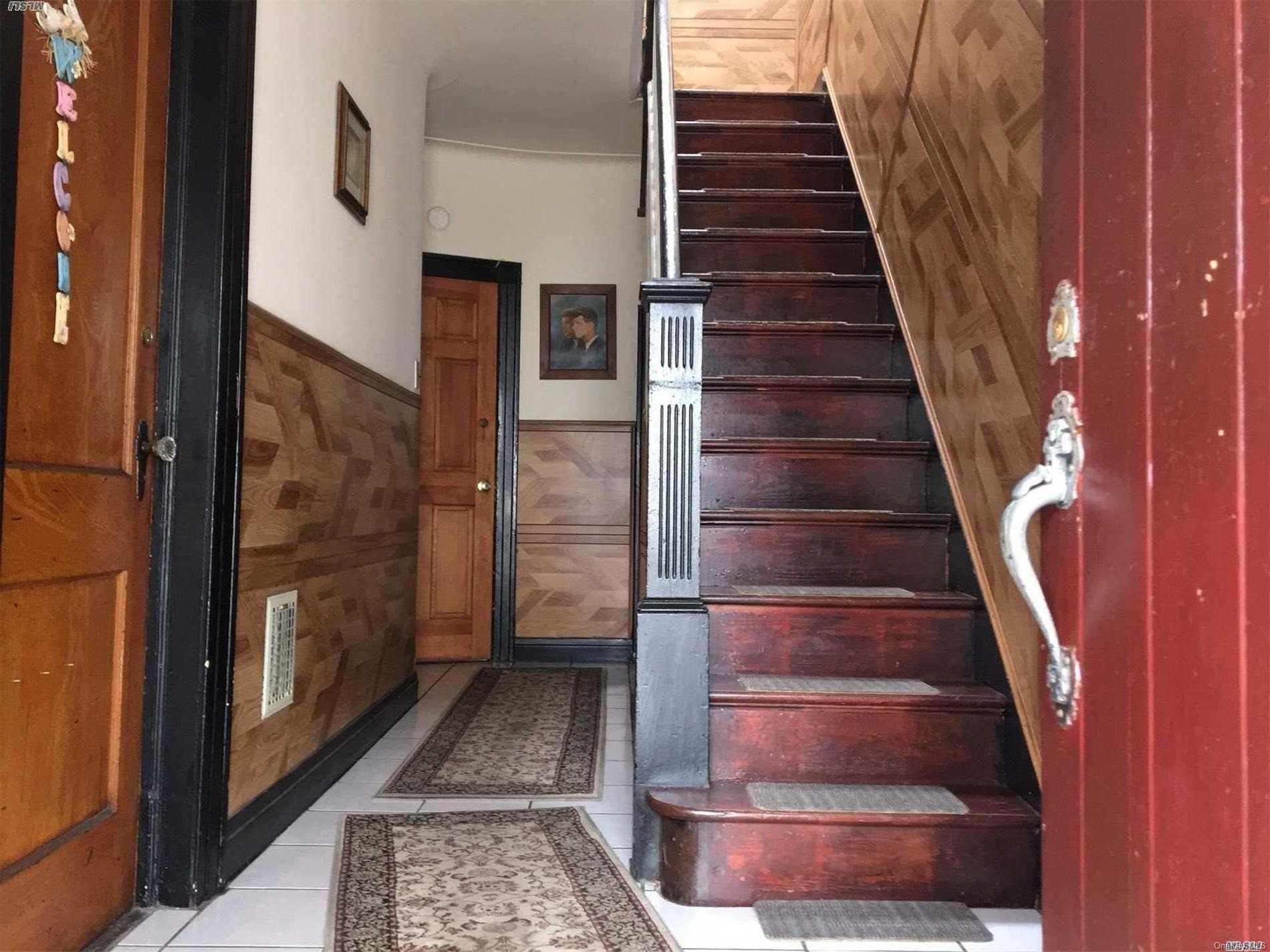 60-13 59th Road Queens, NY 11378 - Photo 8 of 20 a view of entryway and hall with wooden floor