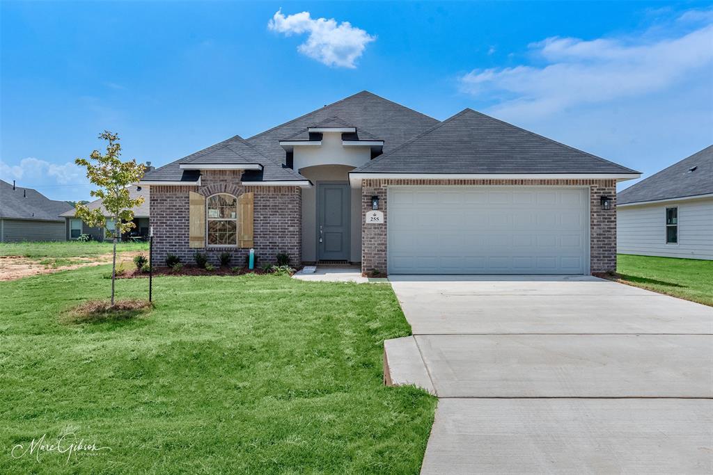 255 Sedgewick Avenue Haughton, LA 71037 - Photo 1 of 1 a front view of a house with a yard and garage