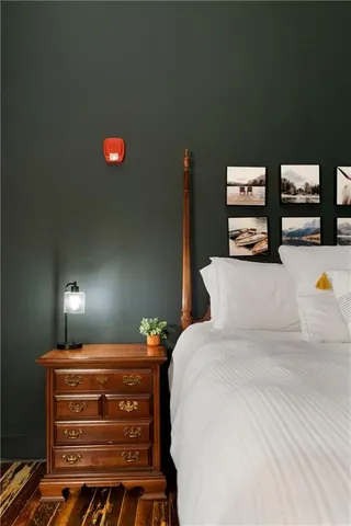 a bedroom with a bed and a table