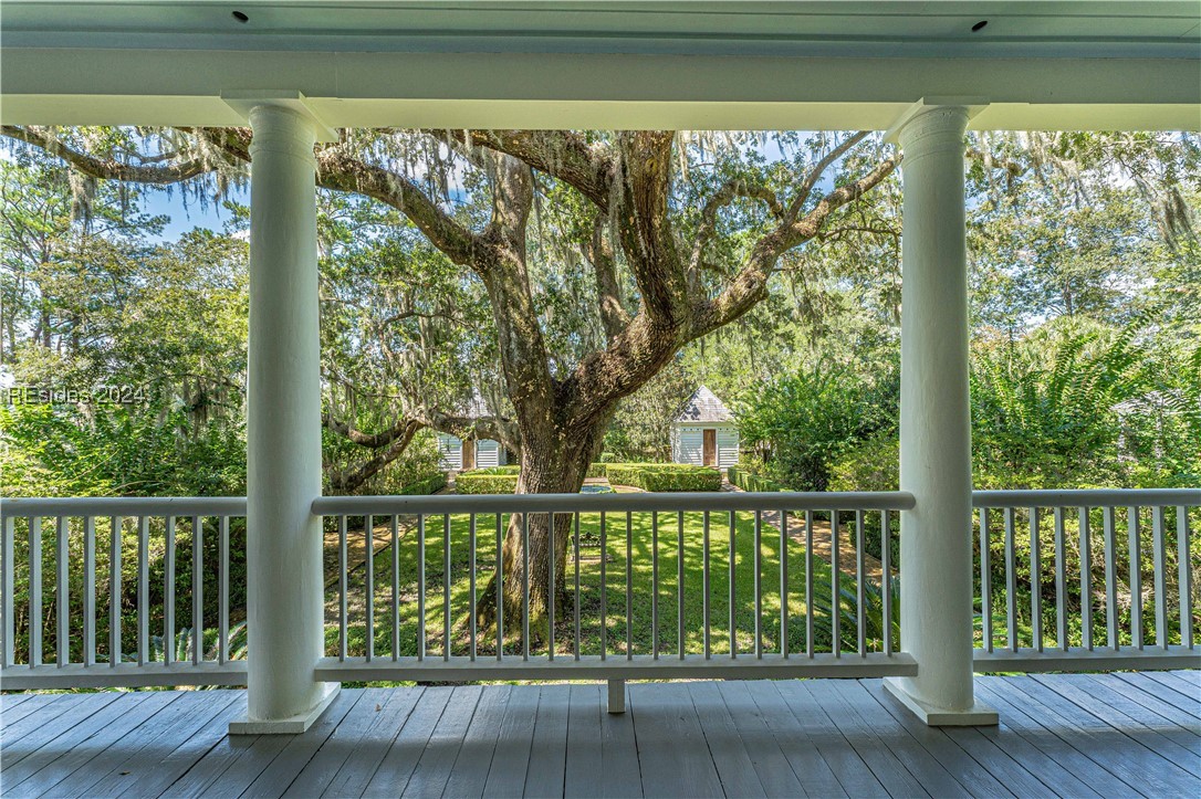 92 Dean Hall Road Seabrook, SC 29940 - Photo 53 of 99 Primary residence porch view to dual pigeonniers