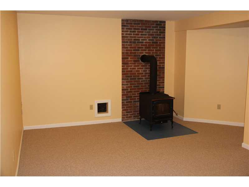 22 Switzer Spring Road Prospect, ME 04981 - Photo 11 of 27 Den/Family/Great Room. Woodstove In...