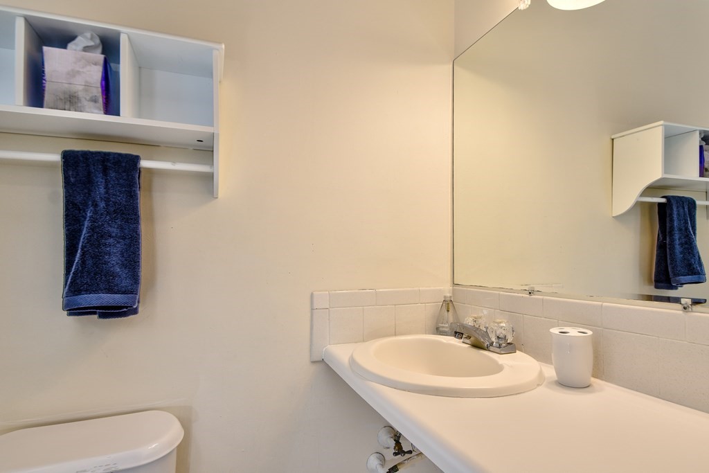 4 Catherine Road Framingham, MA 01701 - Photo 17 of 32 a bathroom with a toilet sink and mirror