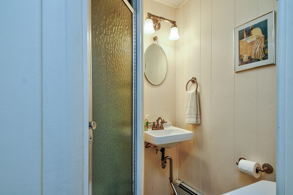 4 Catherine Road Framingham, MA 01701 - Photo 21 of 32 a bathroom with a sink mirror and toilet