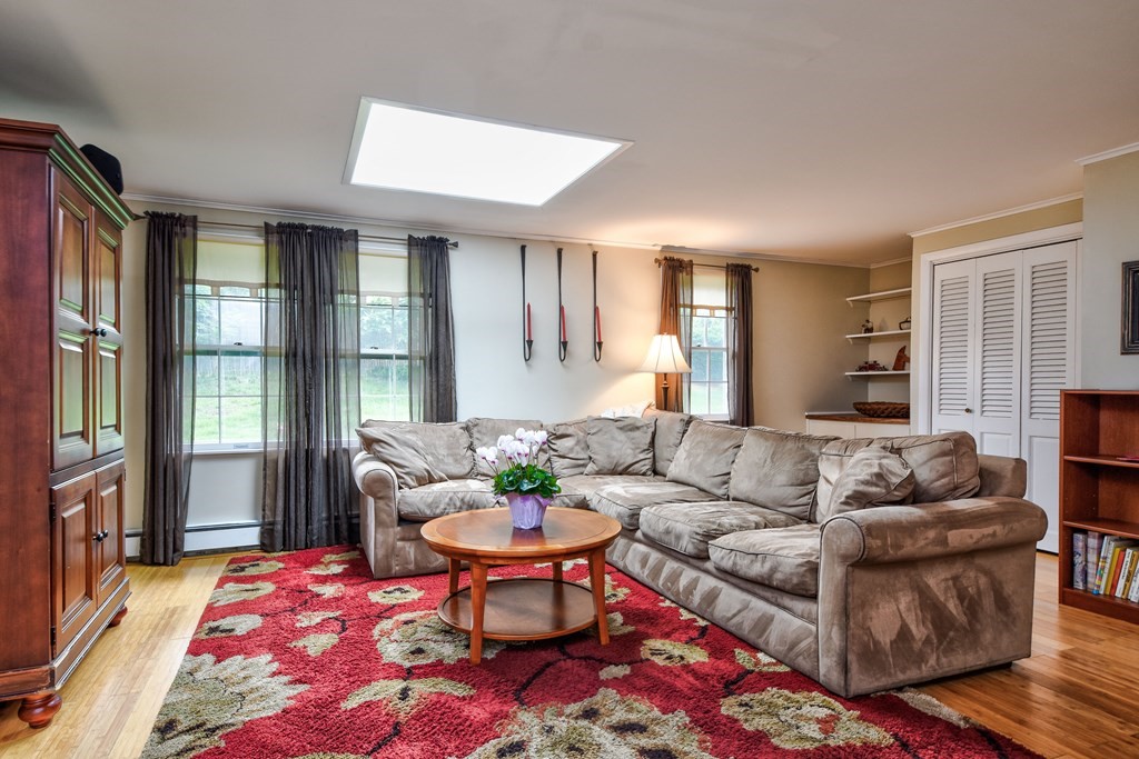 4 Catherine Road Framingham, MA 01701 - Photo 22 of 32 a living room with furniture and a rug