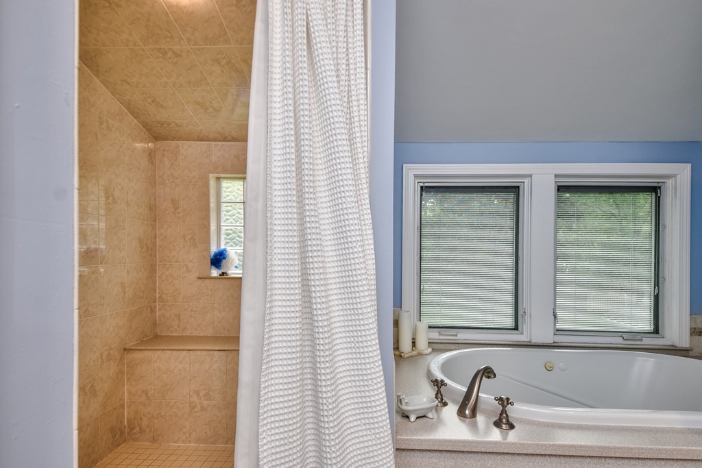 4 Catherine Road Framingham, MA 01701 - Photo 27 of 32 a bathroom with a bathtub and shower