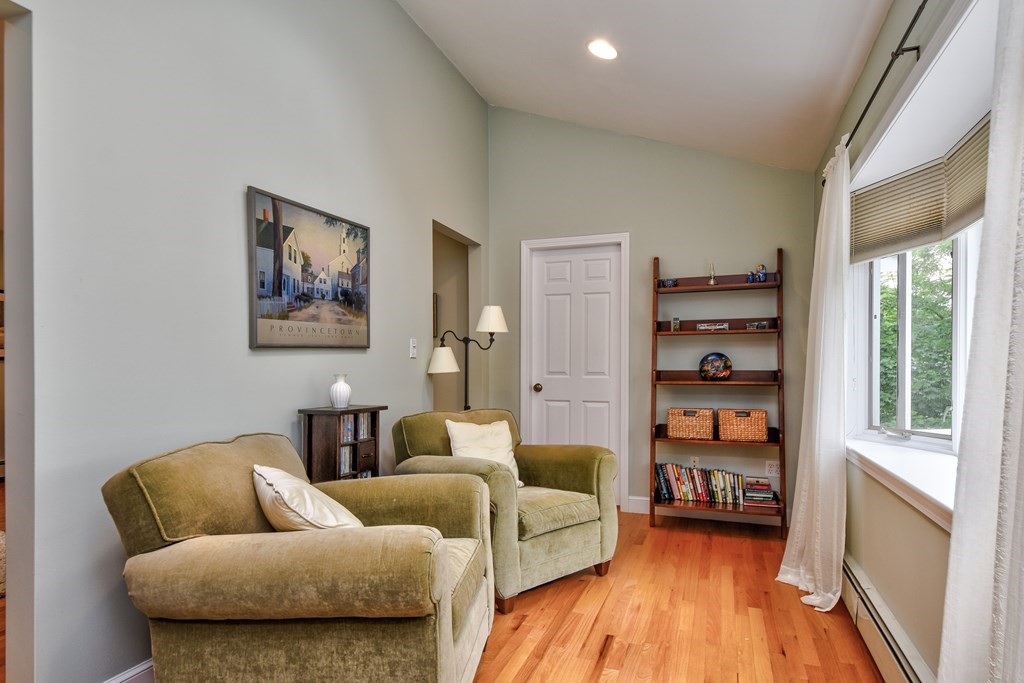4 Catherine Road Framingham, MA 01701 - Photo 28 of 32 a living room with furniture and a book shelf