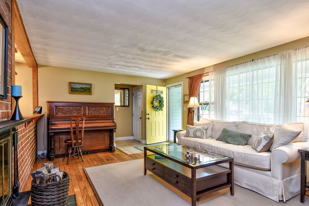 4 Catherine Road Framingham, MA 01701 - Photo 3 of 32 a living room with furniture and a piano