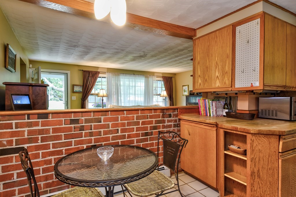 4 Catherine Road Framingham, MA 01701 - Photo 10 of 32 a kitchen with stainless steel appliances granite countertop a sink and a window