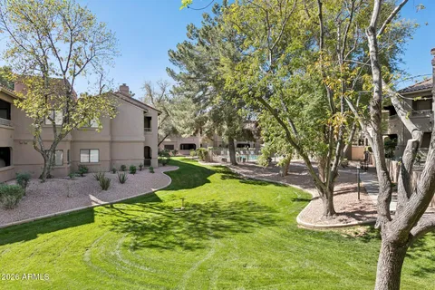 a swimming pool with outdoor seating and yard