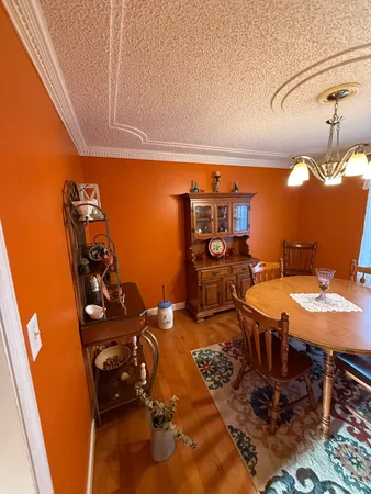 a dining room with table and chairs