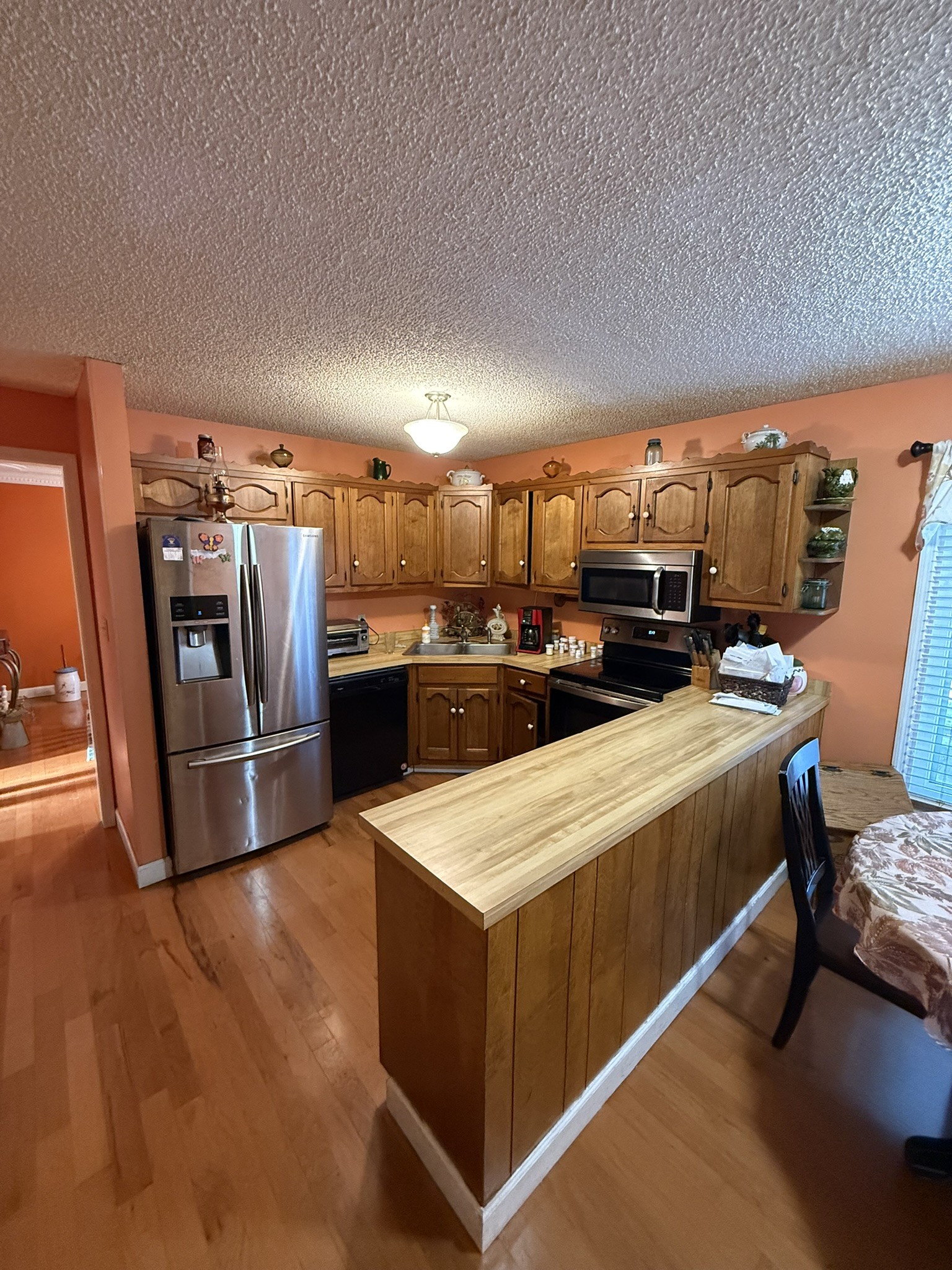 353 Golf Club Road McMinnville, TN 37110 - Photo 20 of 28 a kitchen with stainless steel appliances kitchen island sink stove and refrigerator