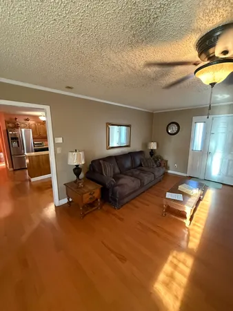 a kitchen with wooden cabinets and stainless steel appliances
