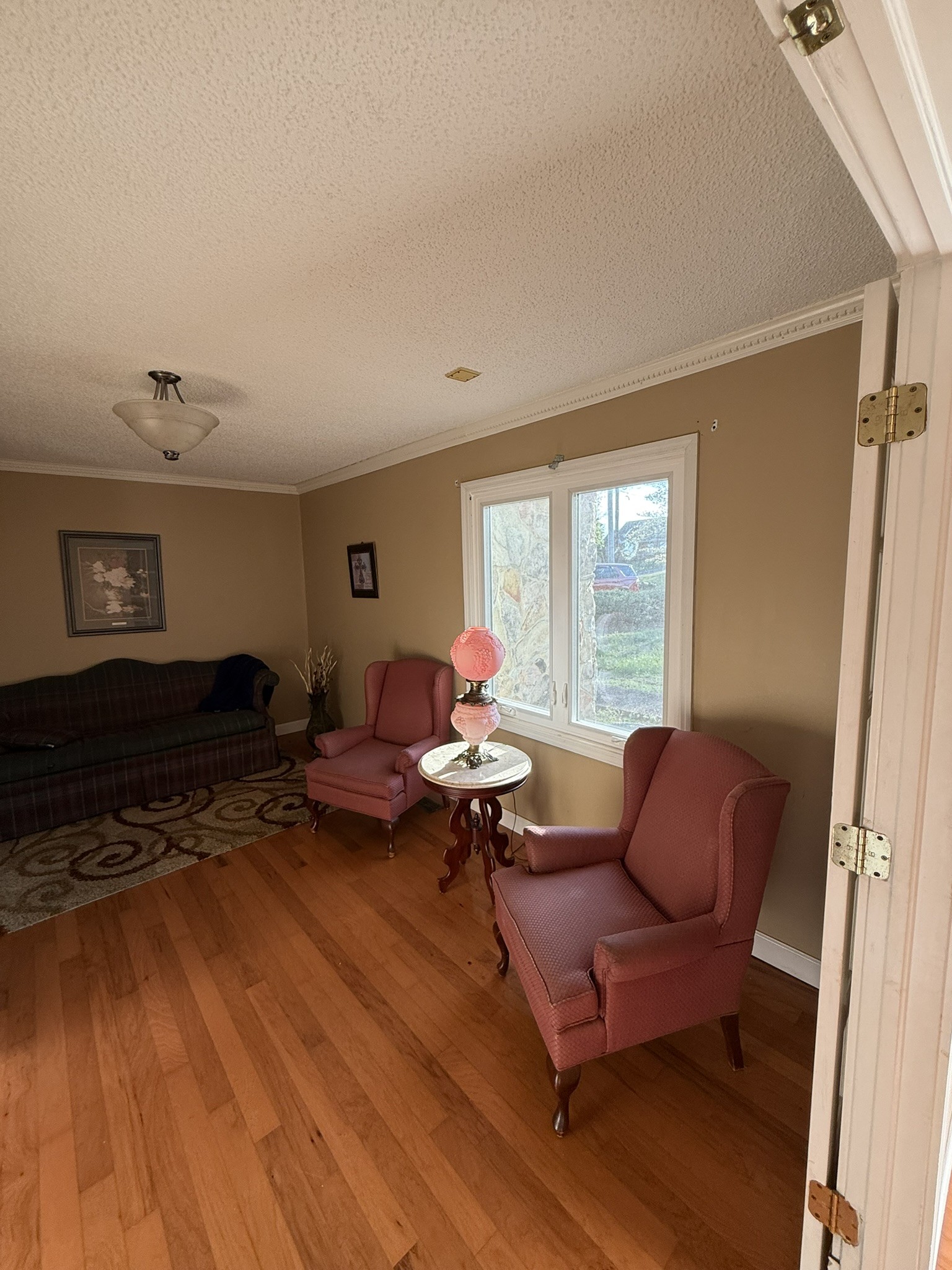 353 Golf Club Road McMinnville, TN 37110 - Photo 28 of 28 a living room with furniture floor to ceiling window and a wooden floor