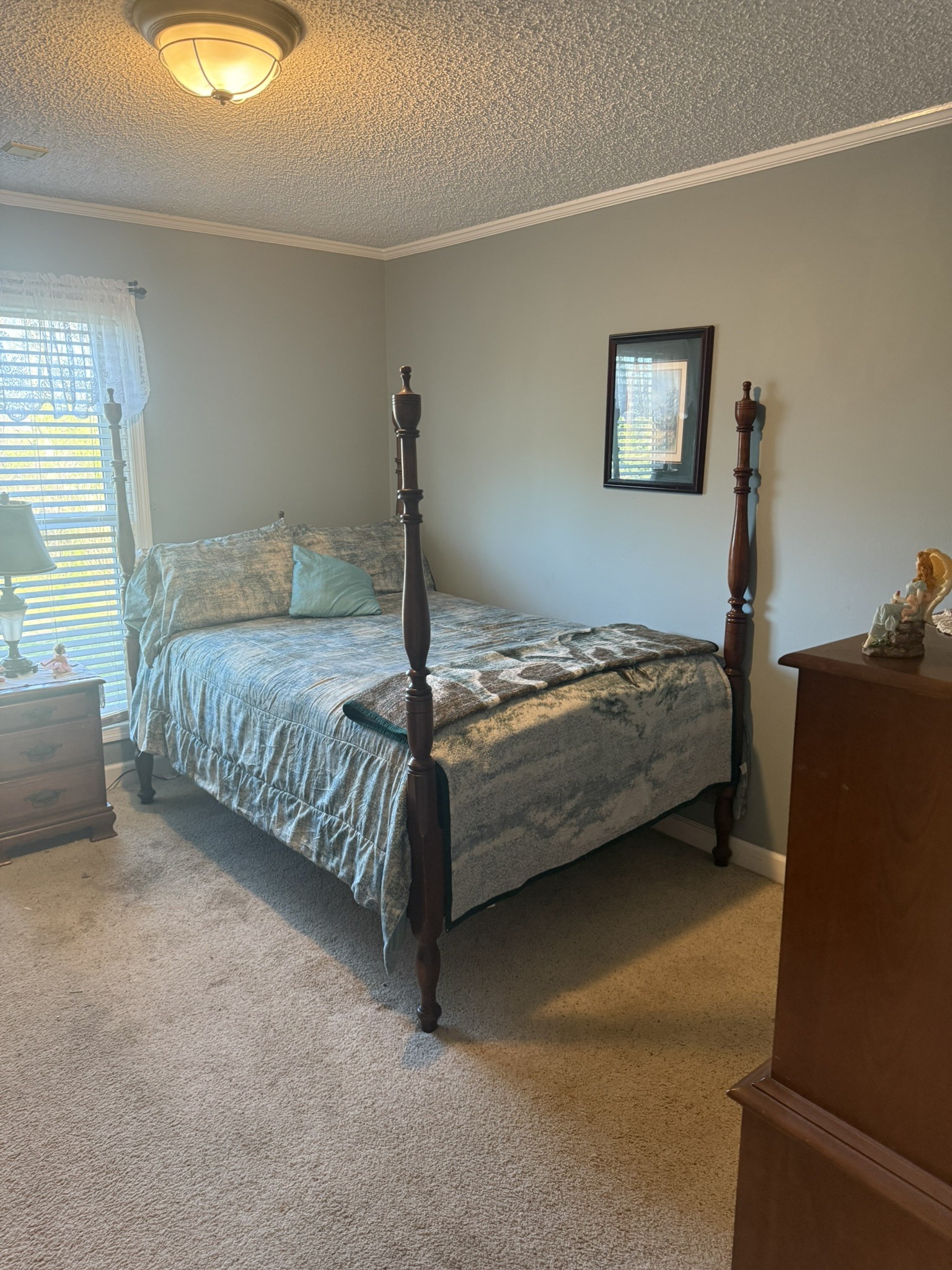 353 Golf Club Road McMinnville, TN 37110 - Photo 6 of 28 a bedroom with a bed and a lamp on dresser