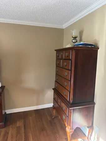 an empty room with wooden floor