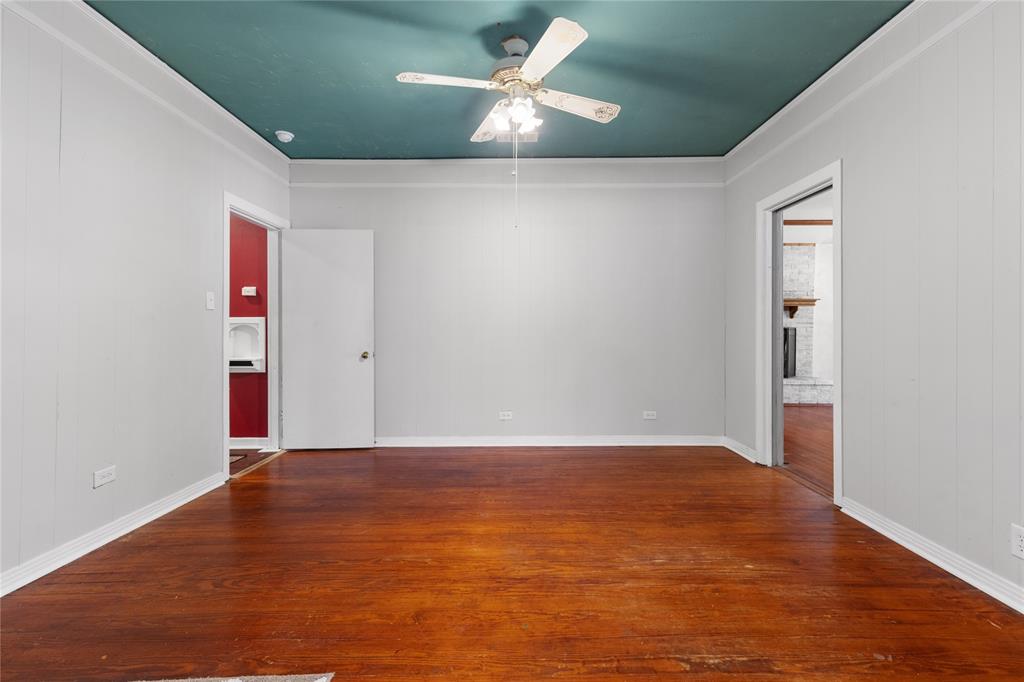 1005 Jernigan Street Commerce, TX 75428 - Photo 40 of 40 an empty room with an entryway and fan