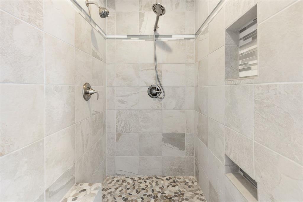 1005 Jernigan Street Commerce, TX 75428 - Photo 18 of 40 a bathroom with a shower