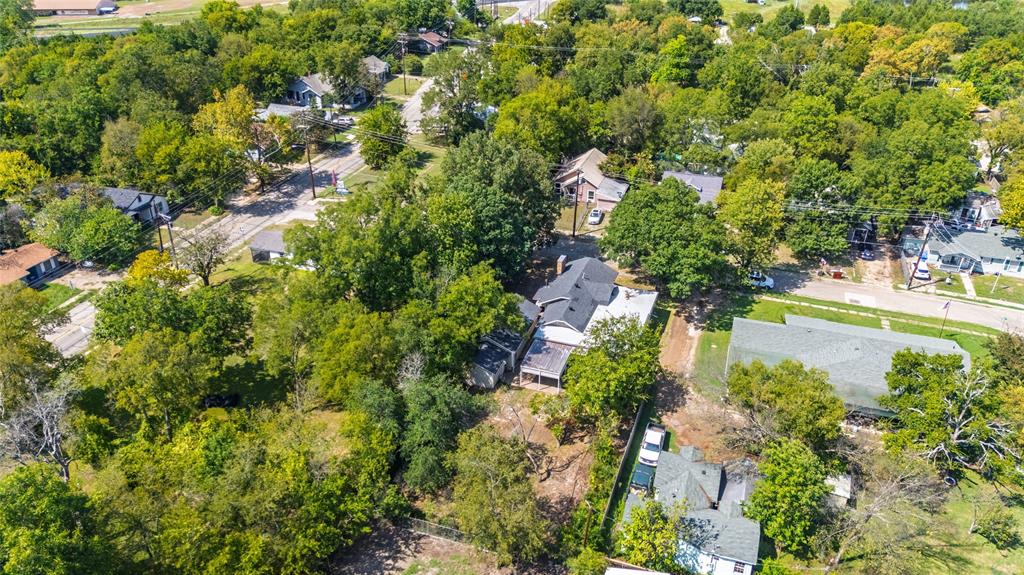1005 Jernigan Street Commerce, TX 75428 - Photo 35 of 40 an aerial view of a houses with yard