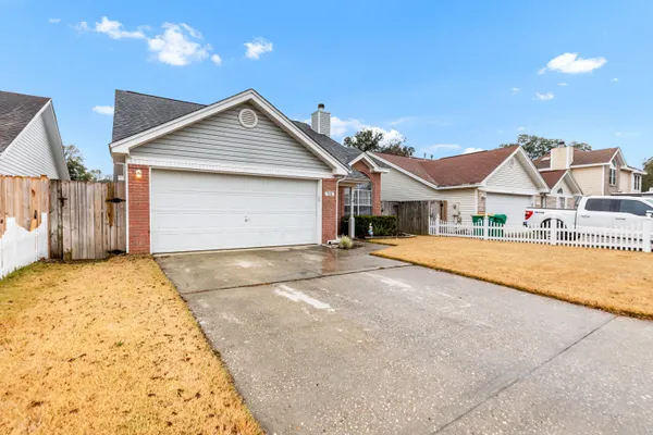 a view of house with entertaining space in front of it