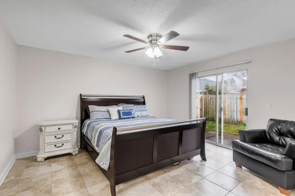 a bedroom with a bed and a couch