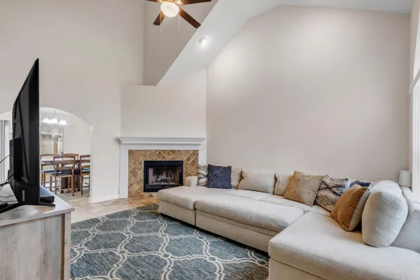 a living room with furniture and a fireplace