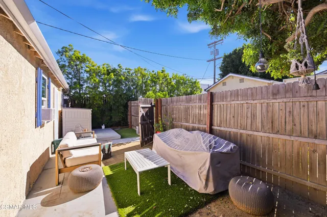 a bedroom with bed and wooden floor